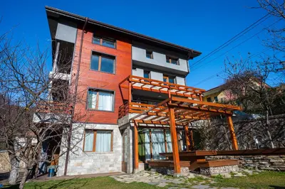a house under construction with a wooden structure at Къща за гости Приказка in Klisura