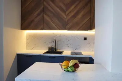 a kitchen with a bowl of fruit on a counter at NEW The Blue Heart Of Sofia Center in Sofia