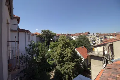 an overhead view of a city with buildings and trees at NEW The Blue Heart Of Sofia Center in Sofia