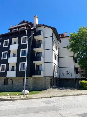 a black and white building with the word foot on it at Hill Top Studio Apartments in Bansko
