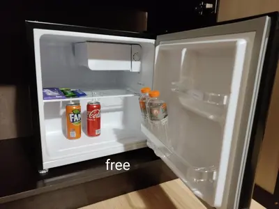 an open refrigerator with drinks inside of it at Студио в Хотел Айсберг in Borovets