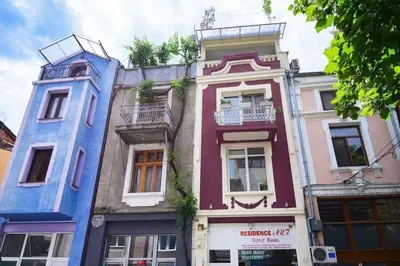 a tall building with blue paint on it at Residence Art Guest House in Plovdiv