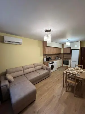 a living room with a couch and a table at New & Stylish Apartment Axel with Mountain Views in Smolyan