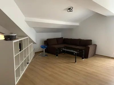 a living room with a couch and a table at Mountain View in Razlog