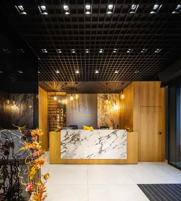 a lobby with a marble counter in a room at B1 Downtown Hotel, Sofia in Sofia