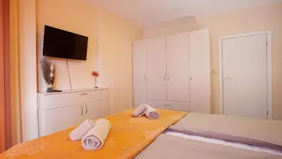 a bedroom with a bed with towels on it at Elevated Living in Sofia
