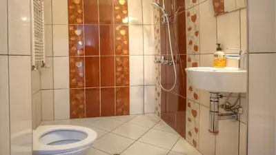 a bathroom with a toilet and a sink at Elevated Living in Sofia