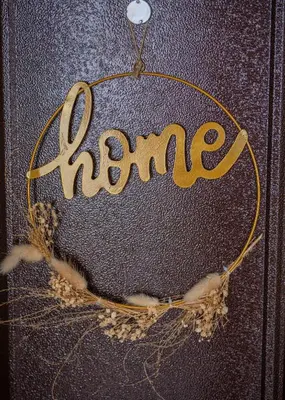 a sign with the word home written on a glass at Boho Apartment Plovdiv with Private Parking Space in Plovdiv