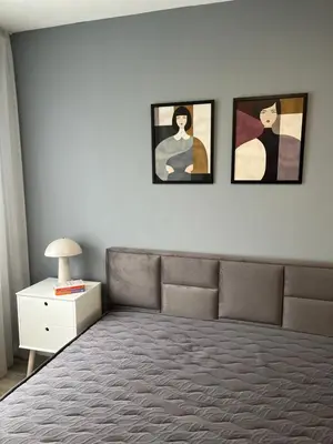 a bedroom with a bed and three pictures on the wall at Paradise Park Apartment Central Sofia Gem in Sofia