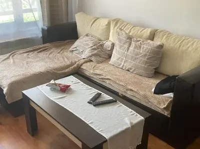 a couch with a table next to a coffee table at Ruhig in den Bergen Bulgariens in Bansko
