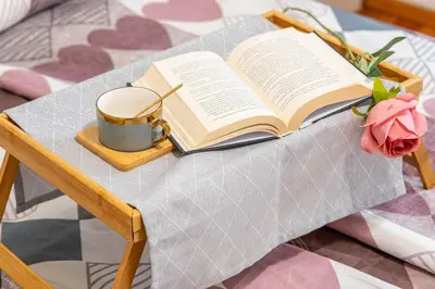 a book and a cup of coffee on a table at The Red Sofa City Retreat in Sofia
