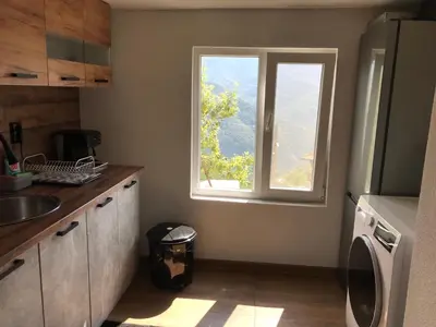 a kitchen with a sink and a window at Boutique house in Devin