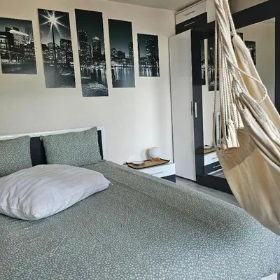 a bedroom with a bed and posters on the wall at Boutique house in Devin