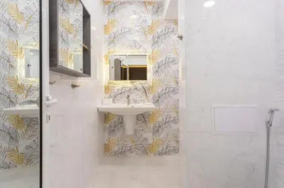 a bathroom with a sink and a mirror at Central St Vitosha Apartment in Sofia