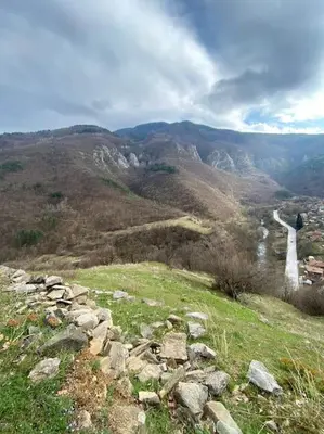a view of a mountain with a road in the distance at Beautiful Villa in the Rodopi Mountains in Narechen