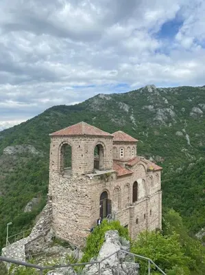a building on top of a hill with a mountain at Beautiful Villa in the Rodopi Mountains in Narechen