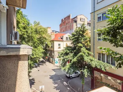 a view of a city street from a building at Cozy 1 bdrm, top center, Solunska near Vitoshka street in Sofia