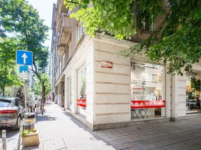 a store on the side of a street next to a building at Cozy 1 bdrm, top center, Solunska near Vitoshka street in Sofia