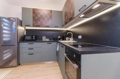 a kitchen with a sink and a refrigerator at Modern 1-Bedroom Apartment with Free Parking in Plovdiv