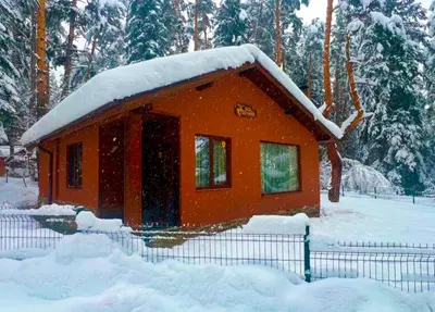 a small house with snow on the roof at Villa Capricorn in Tsigov Chark