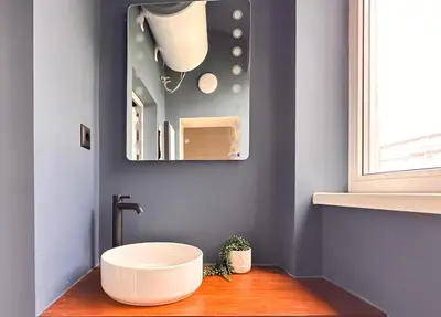 a bathroom with a sink and a mirror at 2 Private Suits - Art, Location, Quiet, Balconies in Sofia