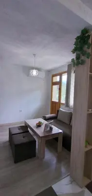 a living room with a couch and a coffee table at Къща Росена - стаи за гости in Devin