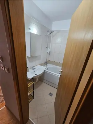 a bathroom with a sink and a tub and a toilet at Aspen Suites Luxury Studio A006 in Razlog