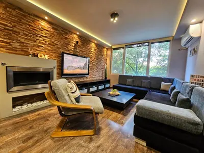 a living room with a couch and a tv at Mladost Sofia, close to Metro Station and Center in Sofia