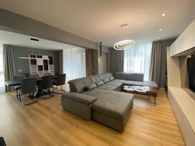 a living room with a couch and a table at Gran Capital - Mountain View, FREE Parking in Sofia