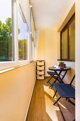 a small dining room with a table and two chairs at Central Park Apartment Dragan Tsankov in Plovdiv
