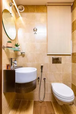 a bathroom with a toilet and a sink and a mirror at Central Park Apartment Dragan Tsankov in Plovdiv