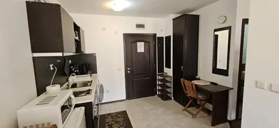 a small kitchen with a sink and a microwave at Guest Suite in Bansko