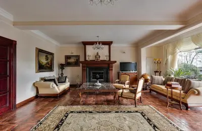 a living room filled with furniture and a fireplace at AMARI PARK Residence in Golyama Zhelyazna