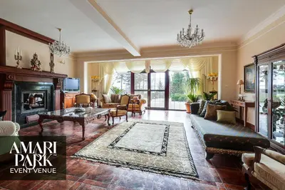 a living room with a couch and a fireplace at AMARI PARK Residence in Golyama Zhelyazna