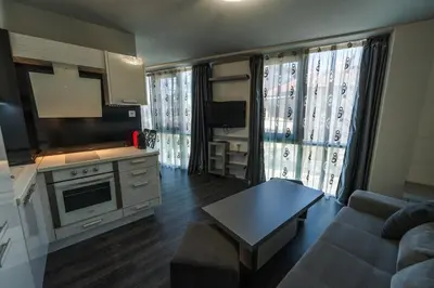 a living room with a couch and a table at Dias in Sandanski