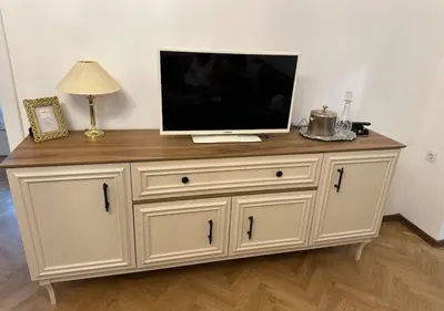 a tv on top of a dresser with a television on it at Apartament 86 in Sofia
