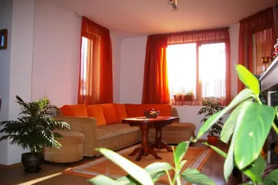 a living room with a couch and a table at Nevena Apartments in Bansko