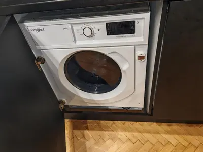 a washer and dryer in a kitchen at Apartament 87 in Sofia