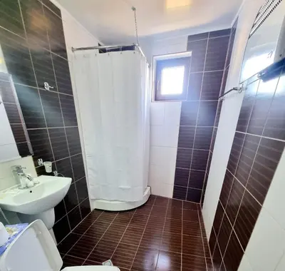 a bathroom with a shower and a toilet and a sink at Studio Vihren 11,Bansko in Bansko