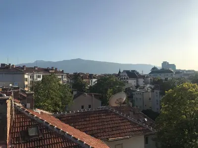 a view of a city with roofs and buildings at TOP CENTER STUDIO - the NEST by Flat Mаnager in Sofia