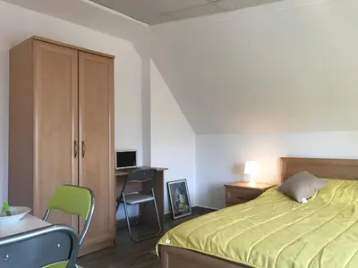 a bedroom with a bed and a desk with a computer at TOP CENTER STUDIO - the NEST by Flat Mаnager in Sofia