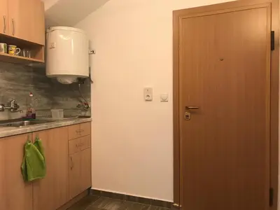 a kitchen with a door and a sink at TOP CENTER STUDIO - the NEST by Flat Mаnager in Sofia