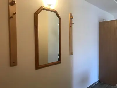 a mirror on a wall next to a door at TOP CENTER STUDIO - the NEST by Flat Mаnager in Sofia