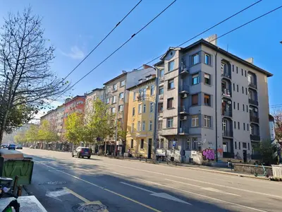 an empty street with buildings on the side of the road at Apartament 88 in Sofia
