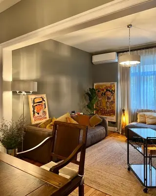 a living room with a couch and a table at Laurel & Hardy - Old city center Apart in Sofia