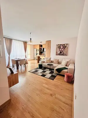 a living room with a couch and a table at Raya apartment in Plovdiv