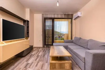a living room with a couch and a flat screen tv at Modern and Cozy 1BD in the Top Centre of Plovdiv by Flat Mаnager in Plovdiv
