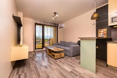 a living room with a couch and a table at Modern and Cozy 1BD in the Top Centre of Plovdiv by Flat Mаnager in Plovdiv