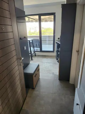 an open door to a room with a table and a desk at V&S Home in Plovdiv