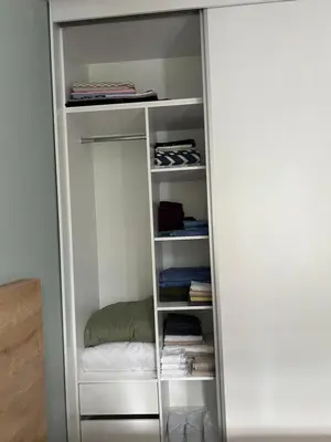 a closet with a door open to a closetploadermottermott at Borovets Gardens Apartment B15 in Borovets